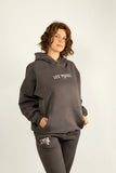 Oracle Hoodie in Midnight Dust — Female Model Standing